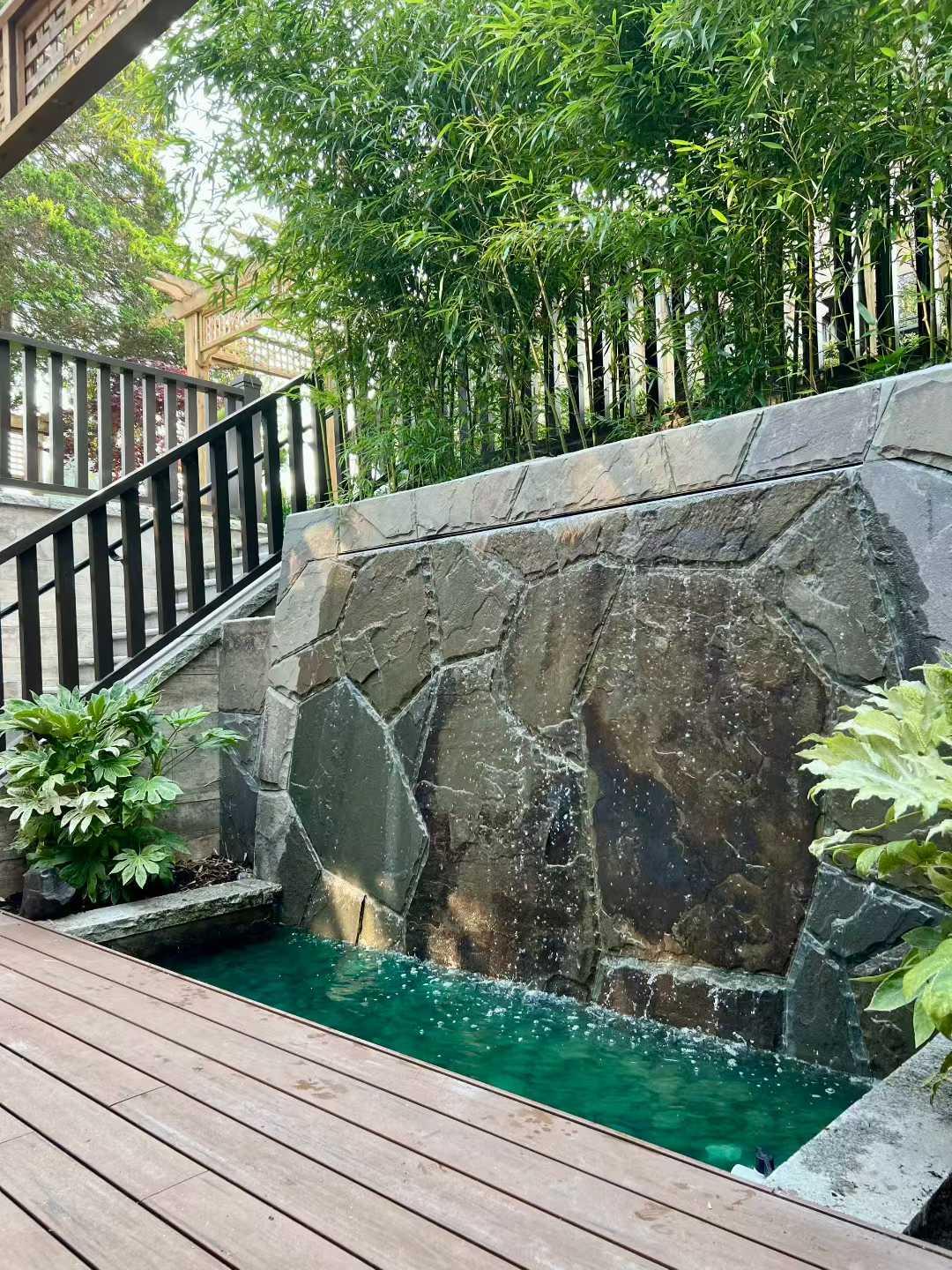 Water fountain feature at a Beechwood residence landscape project.